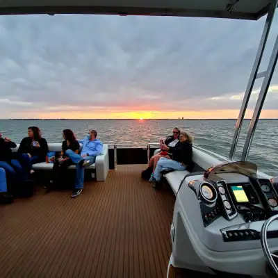 a group of people on a boat in the water