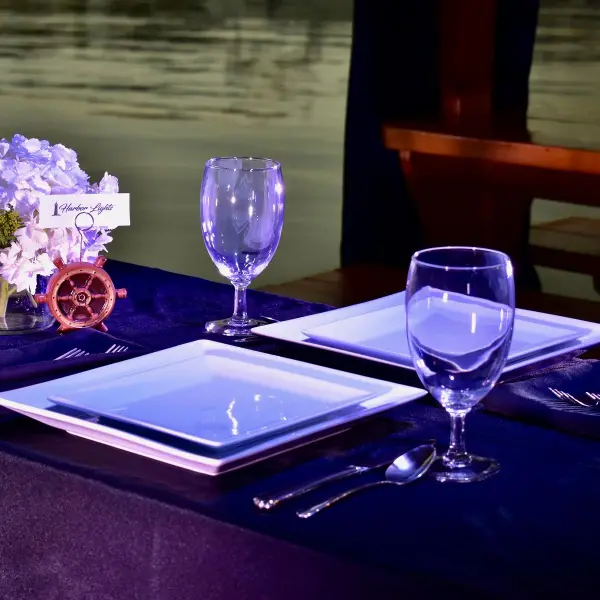 a glass of wine sitting on top of a table