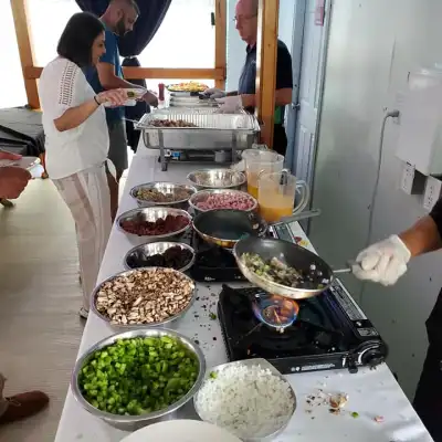 a person standing in a kitchen preparing food