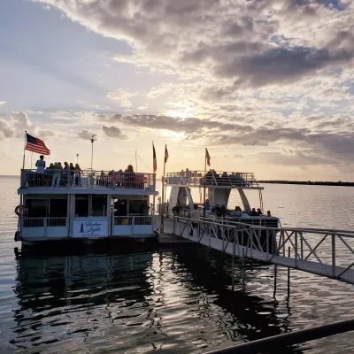 a boat is docked next to a body of water